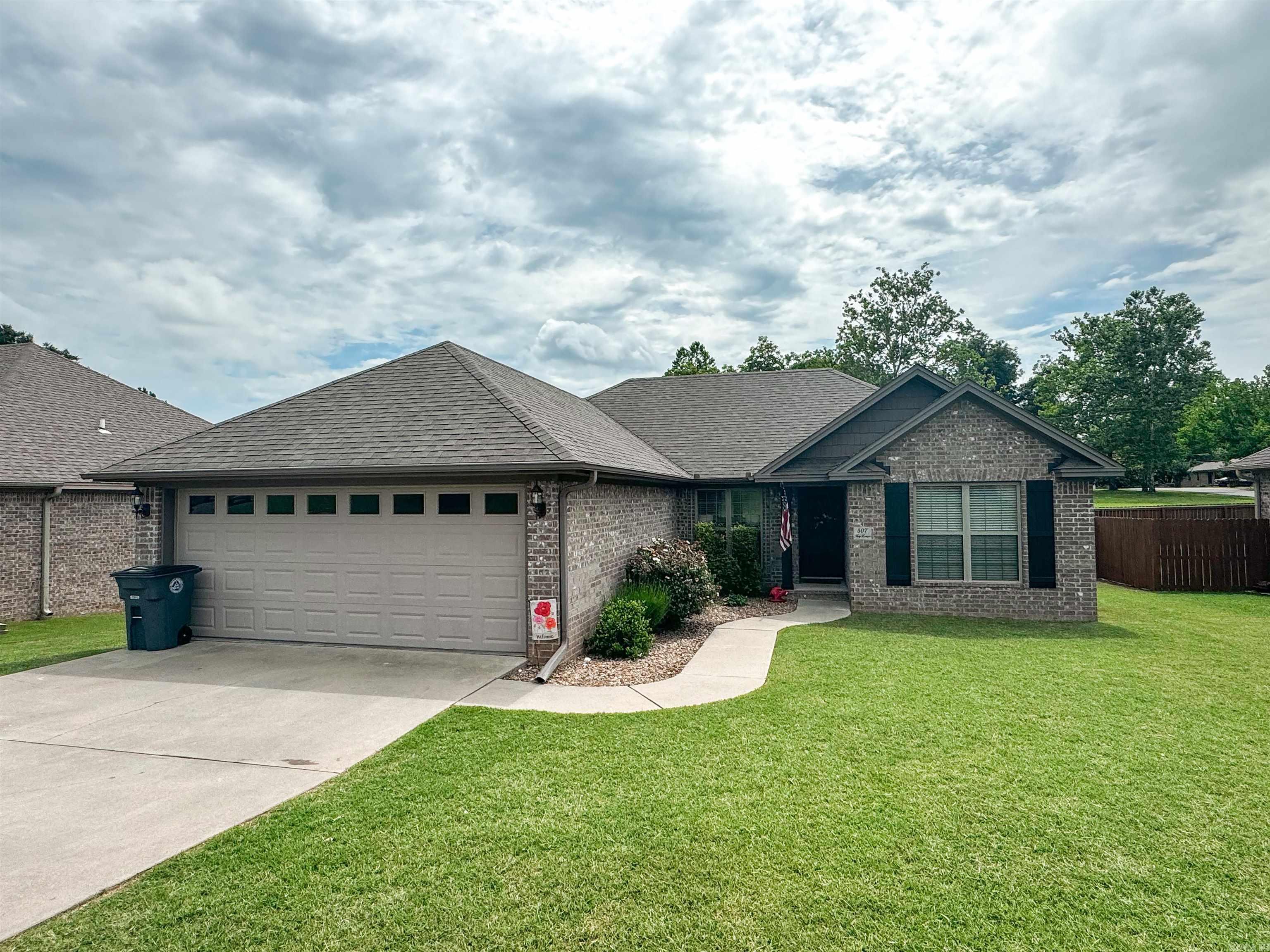 GORGEOUS well-maintained home that is absolutely move-in ready! This allergy-friendly home has no carpet and features gorgeous stained concrete floors throughout that are easy to maintain. Other features include an open floor-plan with the primary suite split from the guest bedrooms and has a double vanity, 2 walk-in closets, private lavatory, custom cabinets & more..PLUS tray ceilings, extra trim and crown molding. The kitchen has stainless appliances & great pantry. Check out the FEMA approved safe room in the garage that doubles as a storage closet. There is a great covered patio for evening entertaining with a privacy-fenced backyard. Call today for your tour!