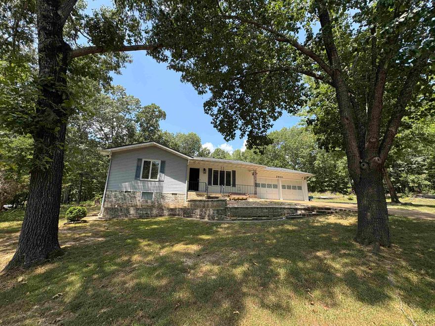 Nice 2 BR 2 Bath with bonus room, 2 car garage home in private setting on 2 flat lots close to Crown Lake