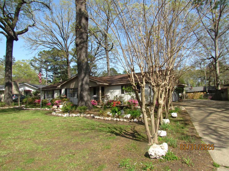 Move-in Ready Brick home with 2,560 sq ft heated/cooled area, great landscaped front door entrance, two living areas, one a huge den open to dining area and kitchen, two dining areas, updated kitchen with breakfast room and bar, dishwasher, refrigerator negotiable,  4 bedrooms with large closets, one , 2 baths, hall bath with shower over bathtub, other with walk-in shower, mud room with tile floor, large laundry closet in mud room, pantry, garage, Covered patio,  sidewalks leading to sitting area in the landscaped Fenced in backyard,  wonderful shop with concrete foundation with roll up door and separate exit door.  Home features luxury wood flooring, all interior freshly painted,  new inside doors, central unit, roof 6 yrs old, 20 X 20 Shop with Concrete pad and double gates to the shop.  Extra storage all through this love4ly home.  This is one home you have to see to know all the amenities.  Water feature and swing in the backyard do not remain.