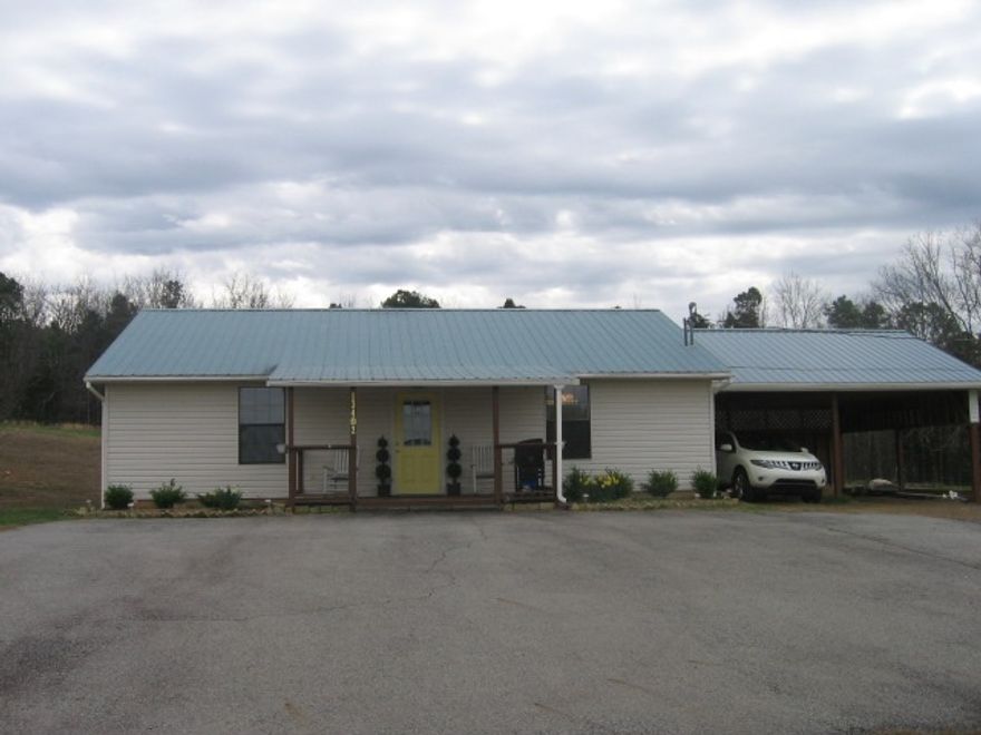 No-smoking  home, lg. greatroom, 2 BR/2Ba with 1200 sq. ft.  Kitchen has wood cabinets, an island, & all appliances included. Large Master BR, &  Master Bath has shower, pedestal sink.  Guest Ba has Corian, footed tub.  Laminate floors & carpet.  Central heat (propane) & air. House has a 2-car carport, some storage in attic area, & a metal roof, guttering. Some landscaping. Tenant required to maintain yard.  No cable -- Landlord provides an antennae with booster.  No landline for phone --Tenant responsible.