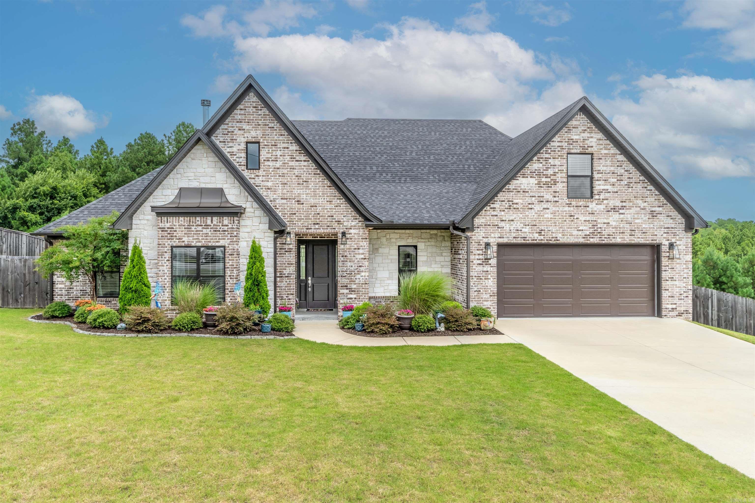 STUNNING is an understatement on the Beauty! 9096 Stone Canyon Drive is PERFECT for any family! Offering 5 bedrooms, 2 & 1/2 Baths, 2676 sqft, & 1.22 ACRES! There's plenty of space for everyone! Open Concept for full family entertainment! Whole house is freshly painted, Cabinets & all! New Kitchen backsplash! Gorgeous Granite countertops throughout! Entry Foyer with a beautiful barrel ceiling! Separate primary with large en suite! Soaker tub, & tiled Walk-in shower! Large primary closet as well! Kitchen offers double ovens & large butler's pantry! Bonus room upstairs could be considered 5th bedroom or extra game room for the kids! Nice Covered patio out back for enjoying time outdoors! All Brick Exterior! back half of the property is Green space! No neighbors behind you! Come see this one today!