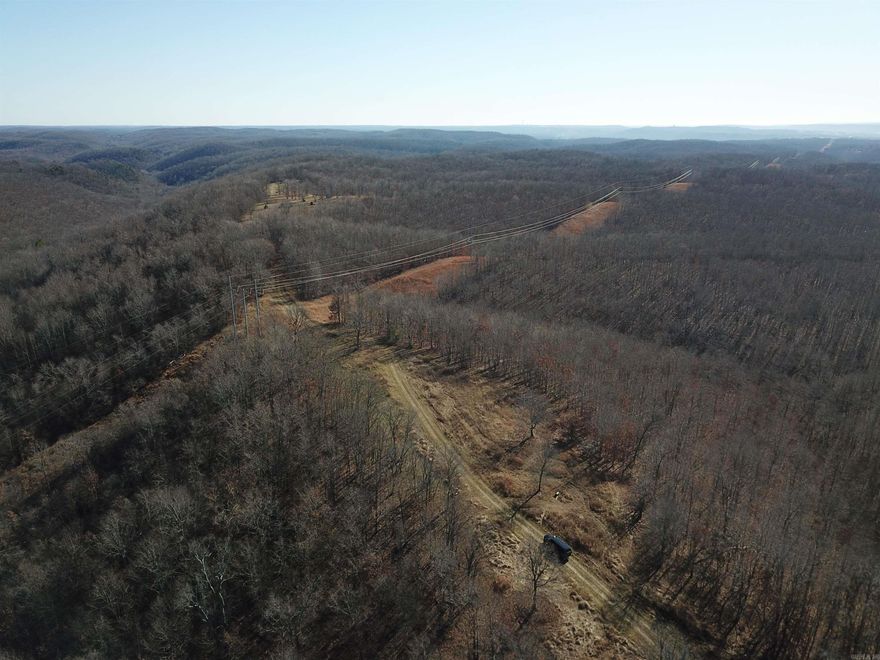 Looking for a hunting tract with an excellent habitat for growing and holding wildlife? This property is secluded yet is minutes from Batesville. The north end of the property is thick cover for deer bedding. As you move south toward the middle of the property, there lies a secluded long ridgetop food plot with scattered oaks. These oaks were littered with scrapes and rubs. The southern end is open oak and various other hardwood timber with many draws. This is an excellent deer and turkey hunting property with the bonus of the occasional bear. A highline power easement cuts through a portion of the property, creating a beautiful long-range view. A pole barn with water at the barn and electric access at the road is a great spot to fill up sprayers, park equipment, or build a nice cabin—scattered persimmon trees located on the property. The current owner has done many habitat improvement projects such as burning, food plotting, stand sites, and road improvement. The land has been surveyed.