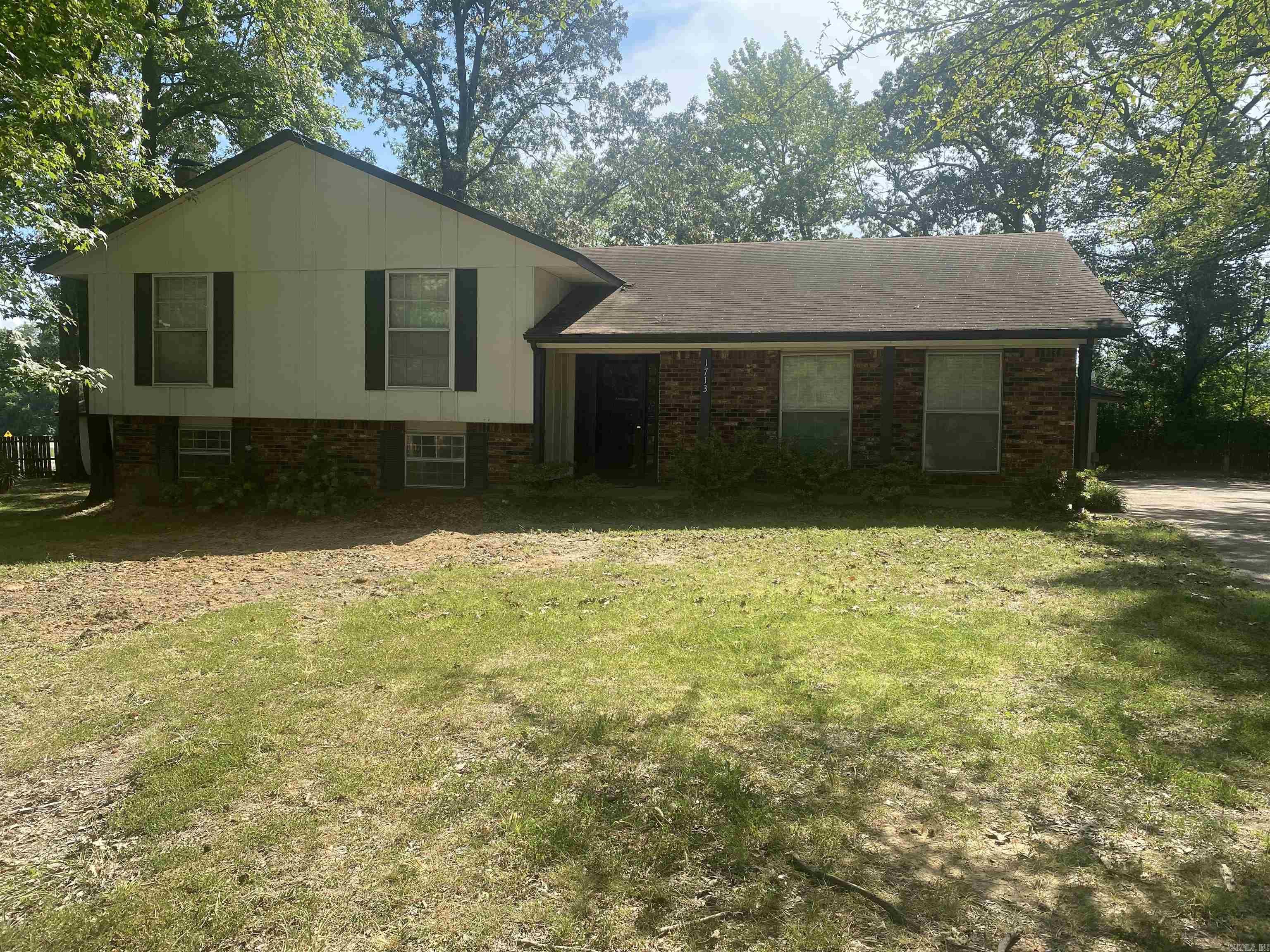 The main floor of this split-level home has hardwood and contains a formal entry, large living room and good-sized kitchen with white, painted cabinetry. The upper lever has 3 bedrooms and 2 baths. The lower level has an additional living area with wet bar, fireplace and the home's 4th bedroom, half bath and laundry. The guest home has a kitchenette, bathroom and living/dining space and is floored in ceramic tile. Current systems/appliances are not guaranteed to work. Seller does not automatically pay typical closing costs for our area. Seller will pay any back taxes, prorate current taxes, and pay up to $150 for deed prep. Any additional fees which Buyer requests should be noted on the contract. Home to be sold AS-IS. Agents please read additional remarks. Lot size is not known, survey recommended.