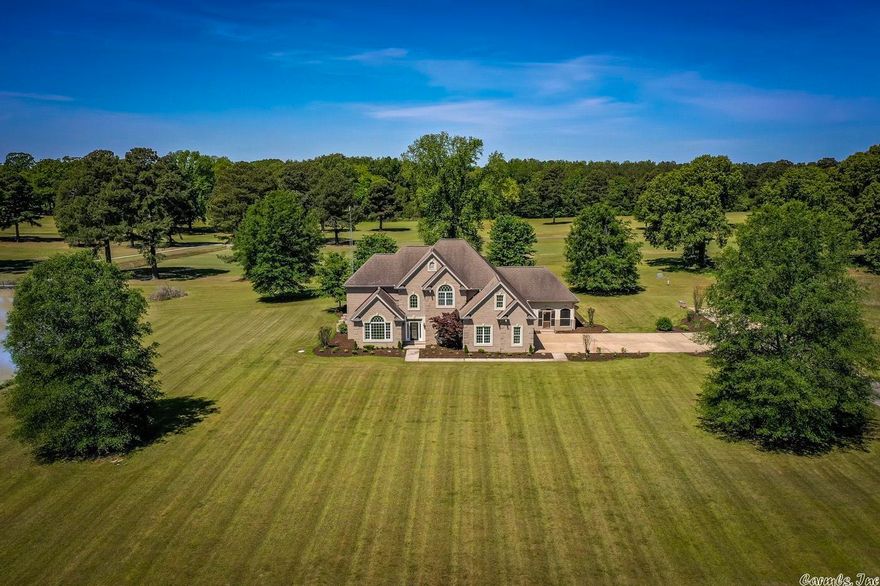 This is an amazing quiet setting for this lovely country estate.  You must see this beautiful, custom- built 4 bedroom, 4055 sq ft home is located on 3.67 acres with a pond, extra large screened in porch and nice patio area.   The home features beautiful wood work, large family living areas, spacious bedrooms and baths, formal dining, office/study and open kitchen with corian counters, eat-in bar and area for dining table. There are also 2 gas burning fireplaces, and a small basement.  This property is located next to a nice golf course. There are many closets and an additional small garage for a golf cart.  Make an appointment today!