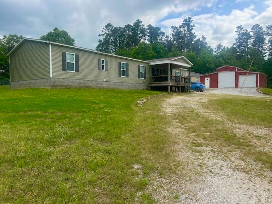 Spacious custom double wide manufactured home on a permanent foundation offering over 2100 sq ft of comfortable living space. This well designed home features 4 bedrooms, 2 full bathrooms, and a dedicated office-perfect for working from home or extra space. Situated on 3.26 acres, the property offers privacy and room to grow. With some selective tree clearing, you would have scenic views of the Beautiful White River. Public river access is only minutes away. Outdoor features include a large detached garage/shop, fully finished she shed with potential for guest quarters, and an additional storage building within the fenced backyard. There's plenty of room for gardening,recreation, or simply enjoying the peacefull setting. Conveniently located between Mountain View and Batesville, this property combines space, versatility, and a great location. Call to day to get your appointment to see this home. Being shown by appointment only.