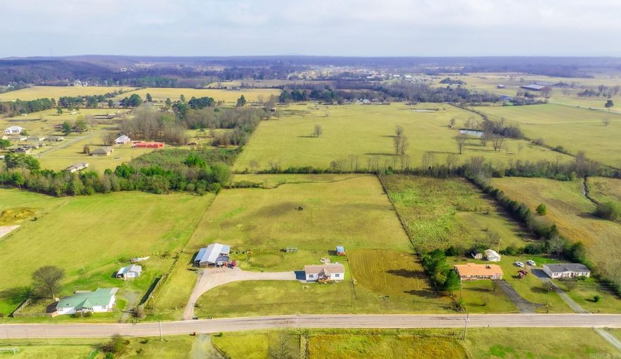 Looking for space to have horses? This property is a rare find. This almost 7 acre meticulous maitntained piece of land with has a pole barn, covered rv parking,  storage buildings and a practice arena with lights. Fully fenced and ready to go. Enjoy evenings on an oversized patio.deck. Back yard also features a firepit. The almost new modular home is on a permanent foundation and has an open concept with 3 bedrooms and two baths. Agent see remarks