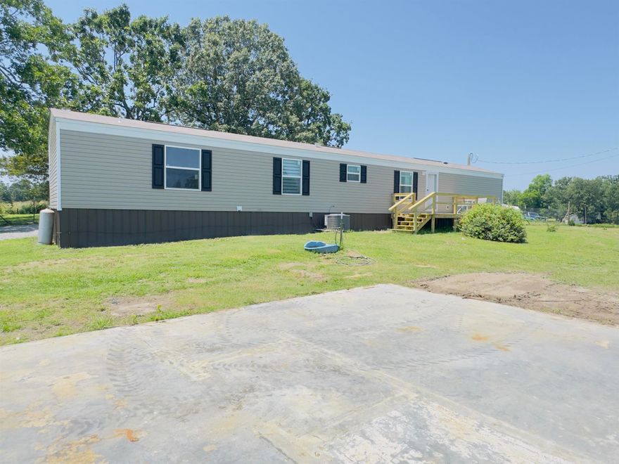 This beautifully designed 2024 Southern Energy-Efficient Smart Zero single wide mobile home is conveniently located just minutes from the Melbourne School District, the golf course, and all of the town’s conveniences, this property is nestled on 3.94 scenic acres surrounded by mature shade trees and open green space.  The home features 3 bedrooms, with the potential for a 4th, and 2 full bathrooms. There are energy-smart features throughout, including LED lighting, high-efficiency energy-rated windows, and a modern electric heat pump and water heater system. With high-speed internet and smart energy systems, you'll stay connected and comfortable year-round while keeping utility costs low. Outdoors, there is a brand-new 8x16 front porch and a large 10x30 covered back deck. The property also includes a separate storage room for added convenience. A major highlight is the 30x50 garage/workshop, along with a newly installed Bald Eagle Barn. Backed by a 5-year warranty, this home is move-in ready and offers the perfect combination of modern comfort, top-tier energy efficiency, and peaceful rural living. Listed for only $169,900.