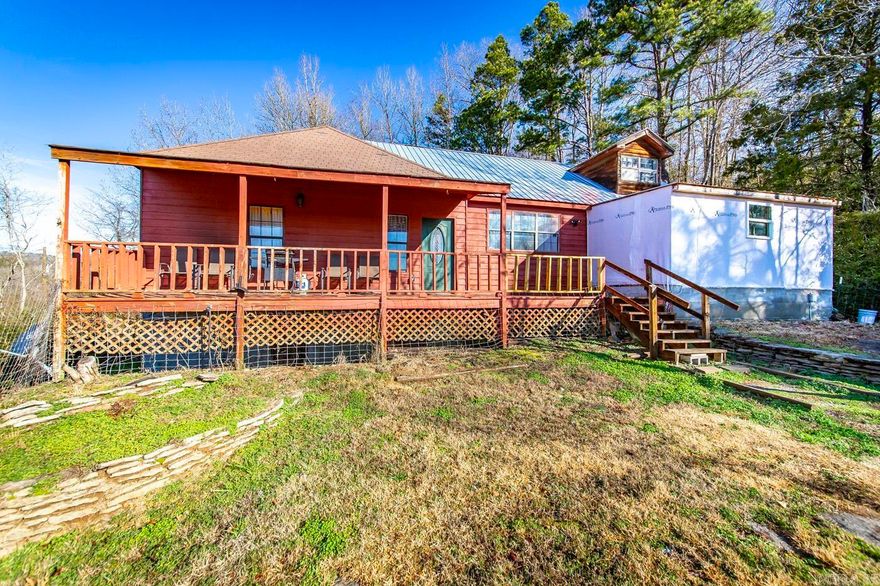 Cute home on 1.55 acre overlooking downtown Shirley w/ beautiful mountain views & a 28x40 shop. The new shop features a concrete floor, power inside the shop (water line is right by the shop), 2 bay doors & 2 walk through doors, 3 windows, metal roofing, and barn wood on the interior. Inside updates throughout the home : 3 additional bedrooms were added, making this a 5 bedroom home, living room w/ beautiful vaulted ceiling & beam, wood floors, upstairs loft w/ windows for reading, extra storage in the loft, & a stand up crawlspace, floating breakfast bar in kitchen, vinyl floors, built in bookshelves & closet racks, floating storage shelves, carpet, textured walls, paint, metal roof, kitchen appliances convey, electronic keypad for keyless entry on all exterior doors, and new light fixtures. Private setting, country feel, & great location. Walk downtown to the beautiful Middle Fork Little Red River where you can fish and kayay or enjoy several water activities on Greers Ferry Lake at Fairfield Bay, which is just a 10 minute drive. Motivated Seller. Call the listing agent for more information & to schedule a showing.