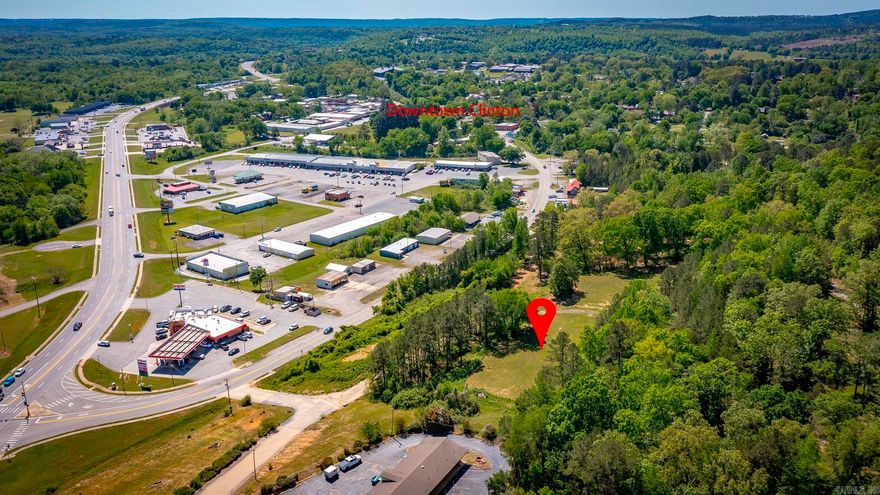 1.6 acres situated on a hilltop overlooking Clinton and Highway 65, offering excellent visibility from both northbound and southbound traffic. Located just off Highway 65B in a high-traffic area beside a well-established hotel, this property provides a strong opportunity for commercial development or investment. The tract features a good access point, with city utilities available, adding to its development potential. Enjoy gorgeous, elevated views of Clinton and the surrounding area, combining scenic appeal with prime exposure. This property is well-suited for a variety of uses.