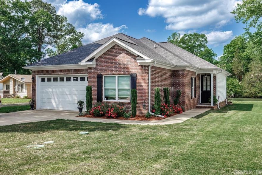MOTIVATED SELLER – BRING ALL REASONABLE OFFERS! This beautiful 3-bedroom, 2-bath lake house on Lake Hamilton is priced to move and ready for your personal touch. Built in 2018 with a brand new roof, this well-maintained home features granite countertops throughout, smart appliances, crown molding, and 9-ft ceilings. The open floor plan is flooded with natural light from oversized fixed windows showcasing gorgeous lake views. Located on a dockable lot with a flat backyard and access to a private boat launch—dock permits are available! Also includes a spacious two-car garage. Don’t miss this rare lakefront opportunity—motivated seller says bring ALL offers!