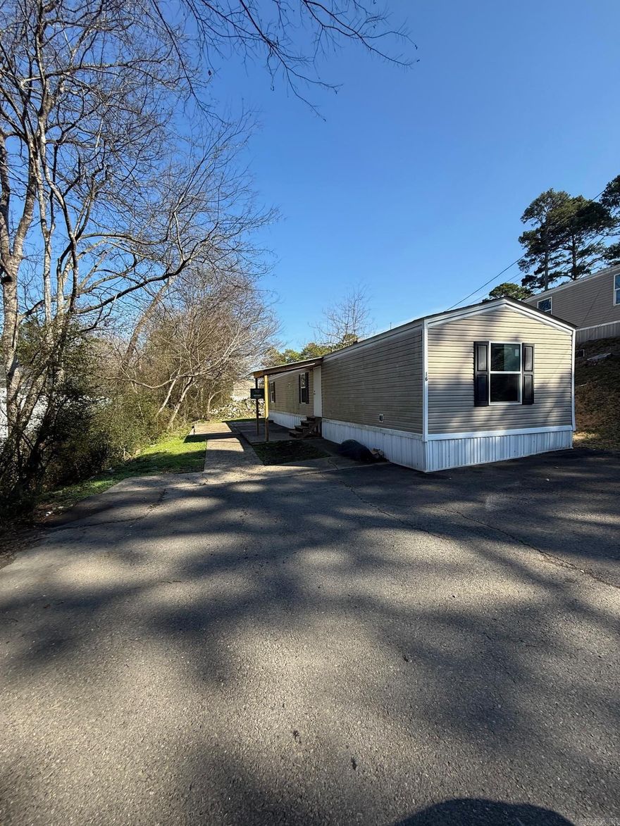 Welcome to our spacious 3-bedroom, 2-bathroom apartment located in the beautiful city of Hot Springs, AR. This manufactured home boasts a modern design with no carpet, making cleaning a breeze. Situated in a peaceful mobile home park, residents can enjoy a serene environment while still being close to all the amenities the city has to offer. With plenty of space for relaxation and entertaining, this apartment is perfect for those looking for a comfortable and convenient living space. Don't miss out on the opportunity to make this apartment your new home sweet home.