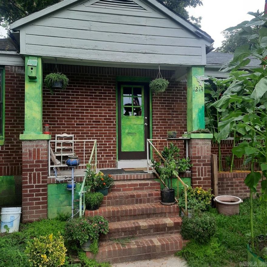 New Listing!  This home features two bedrooms, one bathroom, wood burning fireplace, beautiful garden area along with a paved driveway.  Sold AS IS