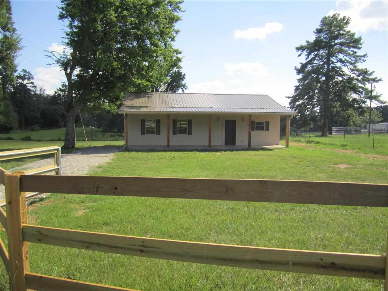 Very cute Country House, Totally Renovated Inside and Out. Hardwood floors, Tile in Wet Areas, Tiled Front Porch, sitting on an 1.00 acre, partially fenced in yard, granite countertops, stainless steel appliances, custom cabinets, Great space to enjoy.
