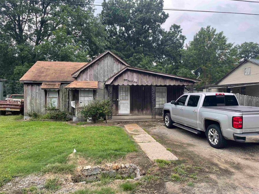 Welcome to this charming 4-bedroom, 1-bath home, offering a blend of comfort and practicality. This delightful residence boasts a living room perfect for family gatherings and relaxation. Adjacent to the living room is a cozy dining room, ideal for enjoying meals with loved ones. The kitchen is designed for functionality and convenience, featuring laundry hookups for easy multitasking. Step outside to discover a concrete slab porch in the back, providing an excellent spot for outdoor dining, entertaining, or simply unwinding. For those in need of extra workspace or storage, the property includes a shop, offering endless possibilities for hobbies, projects, or business needs. Whether you're a growing family or someone seeking a versatile living space, this home is sure to meet your needs. Don’t miss out on this fantastic opportunity to make it your own!