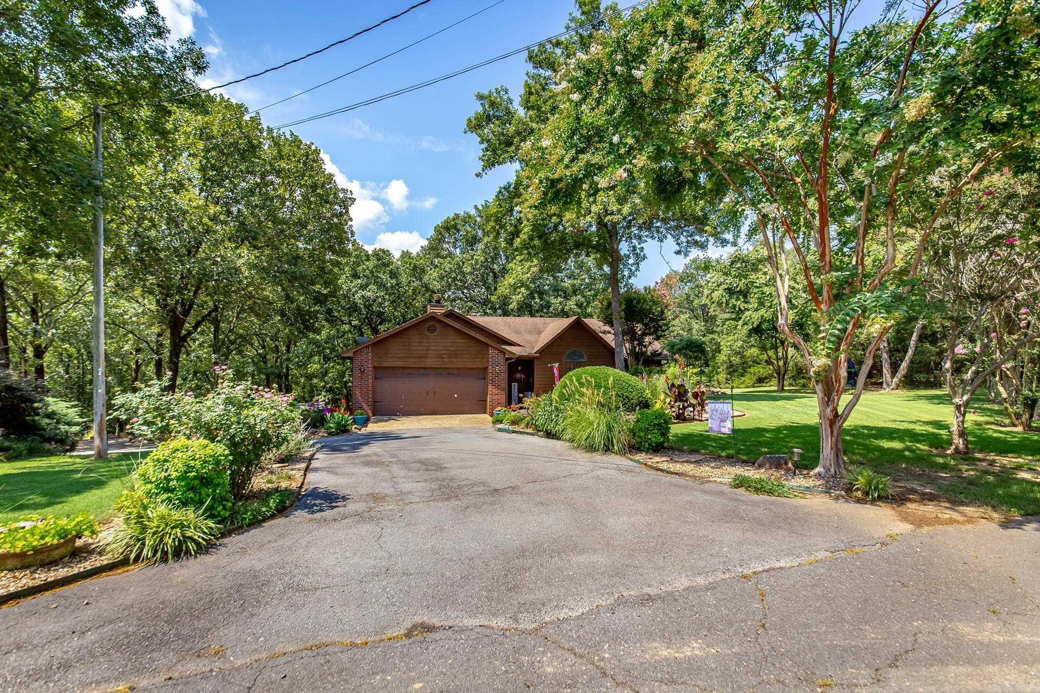 Gorgeous Secluded Custom Home on 3.5 Acres in the OakRidge Subdivision. Home is a Craftsman Home that has vaulted Ceilings and Hardwood Floors, Eat in Kitchen with breakfast bar and Dry Bar. Home features a large fenced back Yard with deck overlooking the property. French doors also provide a additional entrance to back deck from master Bedroom. Bathrooms have received modern updates as well. Home has immense curb appeal. The front yard landscaping makes this home feel like its own oasis. While being close to the city you would never know it on this quiet cul-de-sac with lots of wildlife. Home features a Circle Drive provides lots of parking with an area to build a shop. Home is perfectly situated only 3 mins from the 67/167, 8 mins mins from Shopping. Only 21 mins from LRAFB.