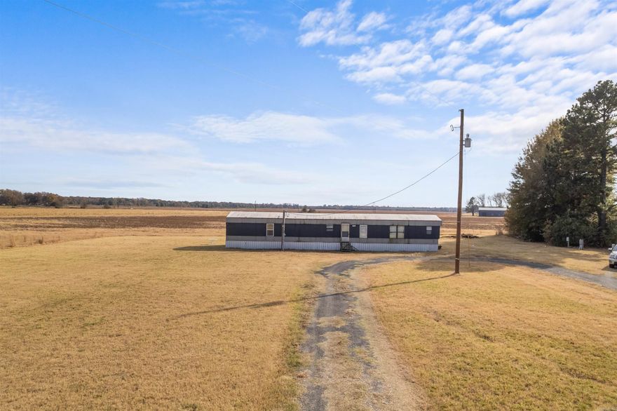 IDEAL HUNTING LODGE LOCATION! The property is approx 9-min from the Cache River National Wildlife River access under I-40, approx 15-min from Dagmar access under I-40, & approx 4-min from the White River access off Hwy 70 in De Vall's Bluff as examples of proximity for Duck & Deer Hunting and/or Fishing too! This Approx 1-Acre Property has City Water, Sewer & Electric onsite connected to 1-Mobile Home that is 3-Bed, 2-Bath & partially remodeled in 2020-2021. Comes fully furnished. This property has 5 RV sites w/Water, Sewer, & Electric Hook-Up too! The property is located on US Hwy 70 in Biscoe. Inside you will find a centralized living room & kitchen space w/Dishwasher, Electric Oven/Stove & Fridge. 3-Bedrooms are setup to maximize occupants staying much like a vacation property w/multiple beds. The property also has 2 nicely equipped bathrooms too! The laundry room is ready to go too! Presently, the mobile and 2 RV sites are rented from Thanksgiving to Jan 31, 2026 so a Buyer would need to honor leases or Close after Jan 31, 2026. NOTE: Approx 1-acre portion of Parcel: 701-00247-009 including the Mobile and 5 RV sites is being sold here. Not the entire Parcel. See Agent Remarks.