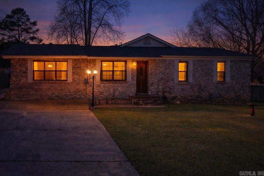 You won’t be short on space here — offering 2,181 sq ft in a convenient Central Arkansas location, less than 10 minutes from I-30. This 3BR, 2BA home features large, well-proportioned rooms, a flexible layout, and character throughout. The revived living room is centered around a gorgeous woodburning fireplace with built-ins on both sides — a true focal point that brings warmth and charm to the space. A separate dining room adds definition, while the breakfast bar supports easy everyday living. The spacious primary suite includes double sinks, a separate vanity, and an additional room ideal for a closet, office, hobby room, or extra storage. A generously sized bonus room with a closet offers even more versatility for a third bedroom, game room, media room, or workspace. Situated on approximately 0.5 acres, the property includes a back patio, 2-car garage, additional parking, and three shop/storage buildings, one equipped with a half bath. All appliances, electronics, and hot tub to convey. Roof replaced in 2023 and water heater serviced in 2025. There’s more here than photos can capture — this is one you need to see in person. Schedule your tour today. AGENTS SEE REMARKS