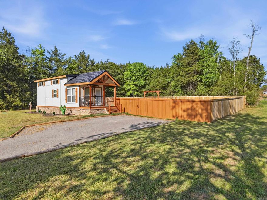 TINY HOUSE TINY HOUSE Come see this fabulous Park Model on just under 1 acre. This place has it all. Large fenced rear yard in a great Greenbrier location. Professional Photos coming soon.