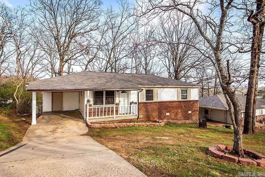 Welcome to 35 Oakview Drive in the Glen Oaks subdivision of North Little Rock — a recently updated one-story home offering comfort and convenience in a central location.  Built in 1968, this 3-bedroom, 1-bath home features approximately 912 square feet of living space, all on one level. Inside, you’ll find original hardwood floors paired with a modern color palette that creates a fresh, inviting feel. The layout includes a great room and an eat-in kitchen that flows easily for everyday living.  Step outside to enjoy a covered patio and deck overlooking the backyard, offering space to relax, entertain, or unwind at the end of the day. The property also includes a carport, driveway parking, and additional storage options. Situated on approximately 0.16 acres, the manageable lot provides room to enjoy without excessive upkeep.  With convenient access to surrounding areas and everyday amenities, this home offers updated style with practical features. Schedule your showing and see what makes this one worth a closer look.