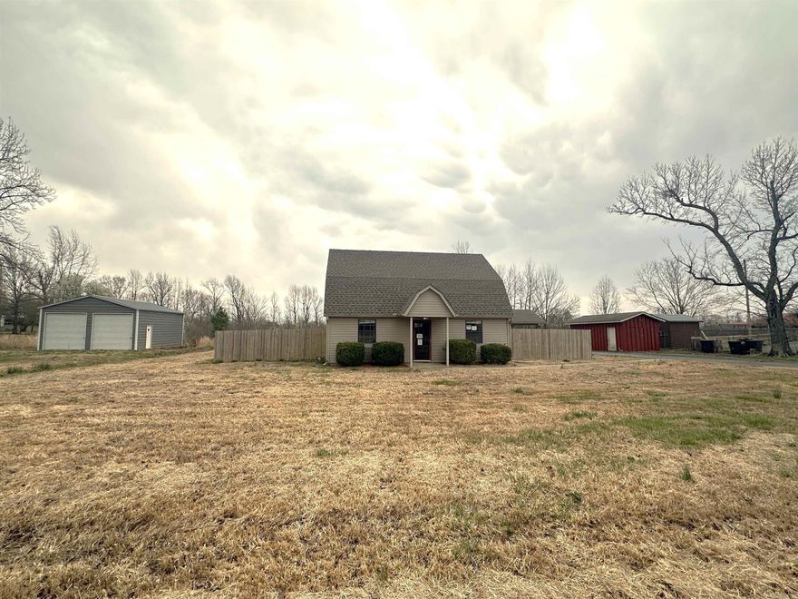 Come check out this cute home with a large shop close to downtown vilonia! House sits on just under an acre with a large shop and separate storage building. Fenced yard. House has 2 living areas with 1 bedroom and 1 full bath downstairs and 2 bedrooms and a half bath upstairs. AGENTS SEE REMARKS.