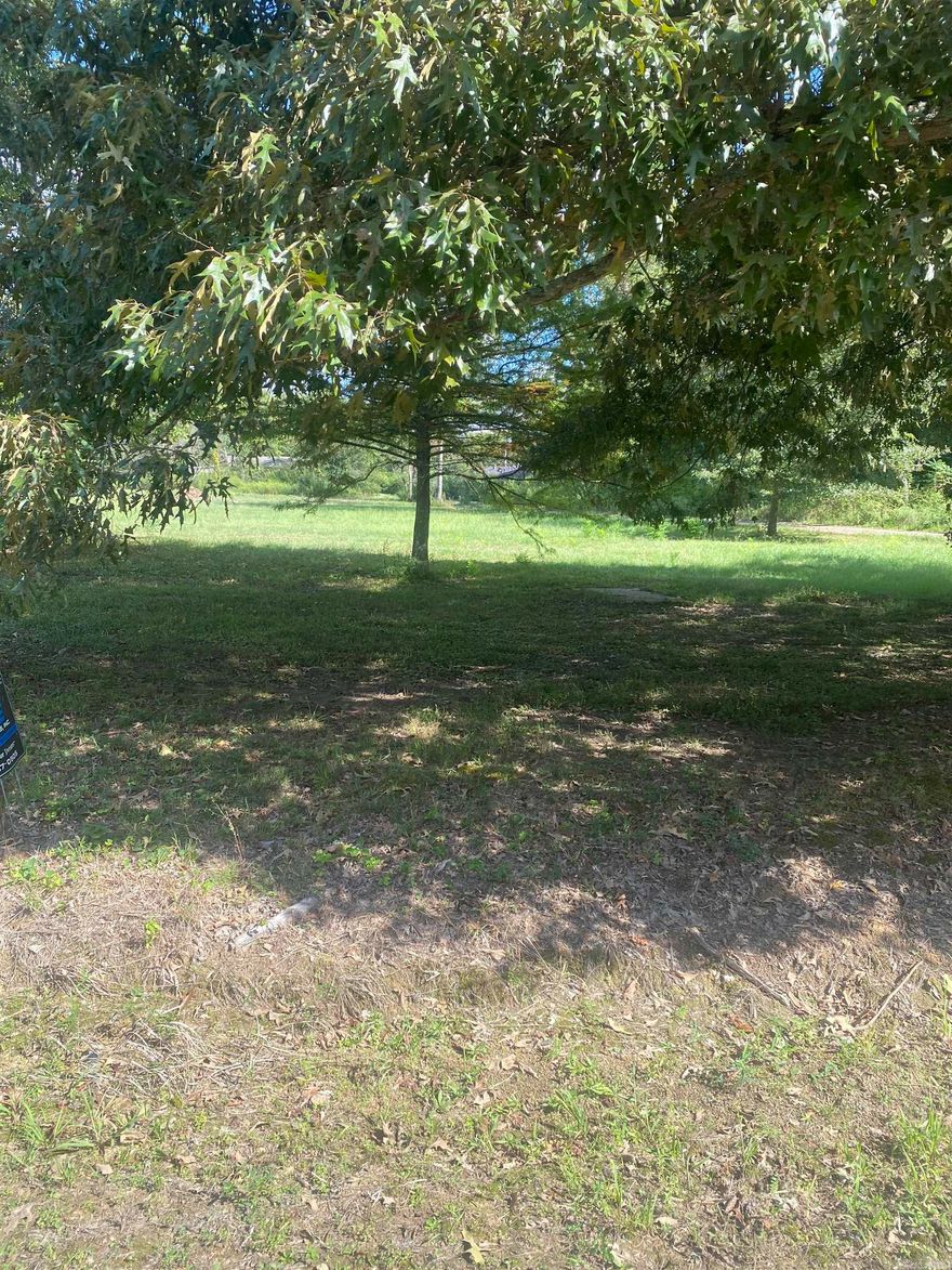 This lots already comes with city sewer and city Sewer.  This is a beautiful lot.. There is a recorded easement for the road to the right of the property.