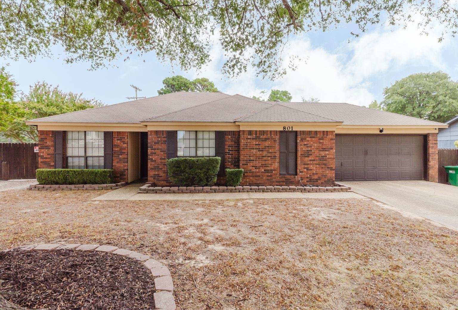 Located on a corner lot in the Bryant Meadows Subdivision and in the heart of Bryant, this three bedroom, two bath home has a split floor plan and is located on a cul-de-sac. Enjoy your morning coffee by the brick wood burning fireplace with a gas starter in the great room. HVAC replaced 2021, water heater in 2020, roof in 2022, jetted tub in primary bath installed in 2024, garbage disposal in 2023 and fence in 2023. Large shop with electricity and ample lighting with access through a double gate is located in the back yard and is negotiable with an acceptable offer. The components of the wireless security system DO NOT convey. Hardwired components to include 3 cameras and a doorbell DO CONVEY. Gas stove in the kitchen is ready for the chef in your family to prepare meals and then relax in the jetted tub in the evening. Walk in closets in two bedrooms provide ample storage. Call your agent to set up a showing today.