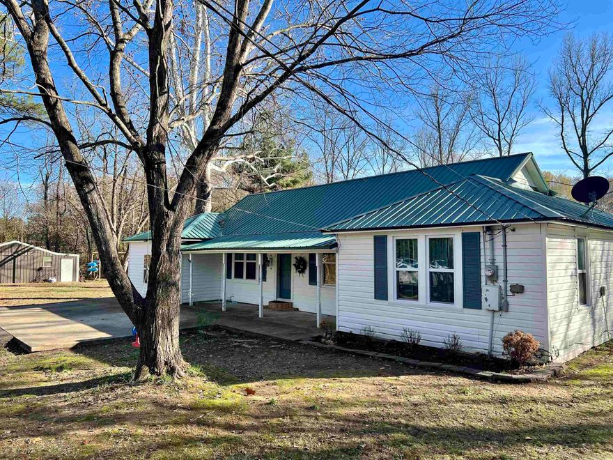 This 4 bedroom, 2 bath, on a 2 acre tract in town provides a spacious yard and a 25x28 shop wired with electric. Located just a few blocks from the local grocery store, post office and medical center, this is a perfect family home! 1768 square feet, split floor plan, spacious dining area and bedrooms. A backyard, surrounded by trees, large enough for games, gardening and/or whatever fits your family! Take a look.