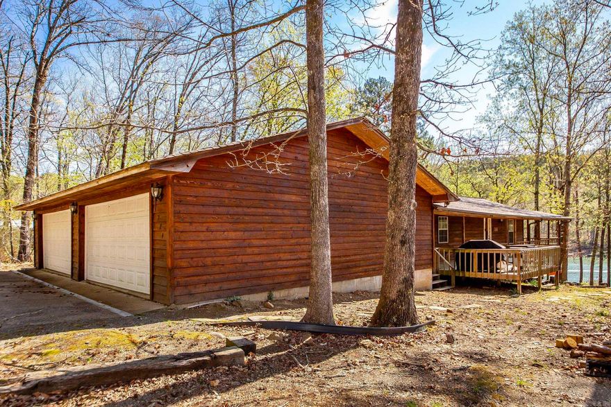 Could we interest you in an awesome hideout? Off the beaten path but just minutes from Hill Creek Marina and Greers Ferry. Boat right up to your back yard. White line is in the water! All the room you could ask for to entertain on the lake. Come and enjoy the lake & lots of privacy. Large covered back deck with Vaulted ceiling. Open floor plan with vaulted ceilings & large wall of windows to enjoy the views in the main area. Main level has 2 bed and full bath. Lower level/basement features 2 bedrooms, den, full bath & covered lower patio. Don't regret not taking a look here. You surely will if you wait too long. Call today!!!