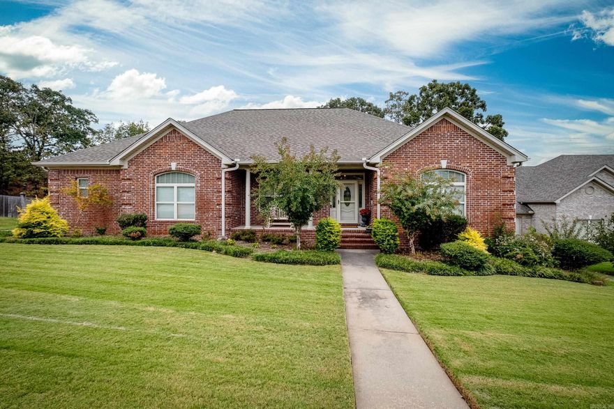 Wonderful custom built one level home in Millers Crossing with a lake view! Rosewood hardwood floors throughout with carpet in the bedrooms. The living room, dining room and Kitchen have an open floorpan with 10 foot ceilings and allows for plenty of natural light. The kitchen has granite countertops, island, breakfast bar, large pantry, abundant cabinets and stainless steel appliances. There is also breakfast room with a bay window. The master bedroom has 11 foot trey ceilings. The master bath has two large walk in closets, oversized jetted tub, large separate shower and two vanities.  Exterior has a patio/deck that overlooks the lake, shop under the house with a poured concrete floor and level backyard. 80 Gallon Marathon water heater. Side loading driveway has a space for an RV with water and sewer hookups. Lots of storage throughout the house, garage and crawl space.