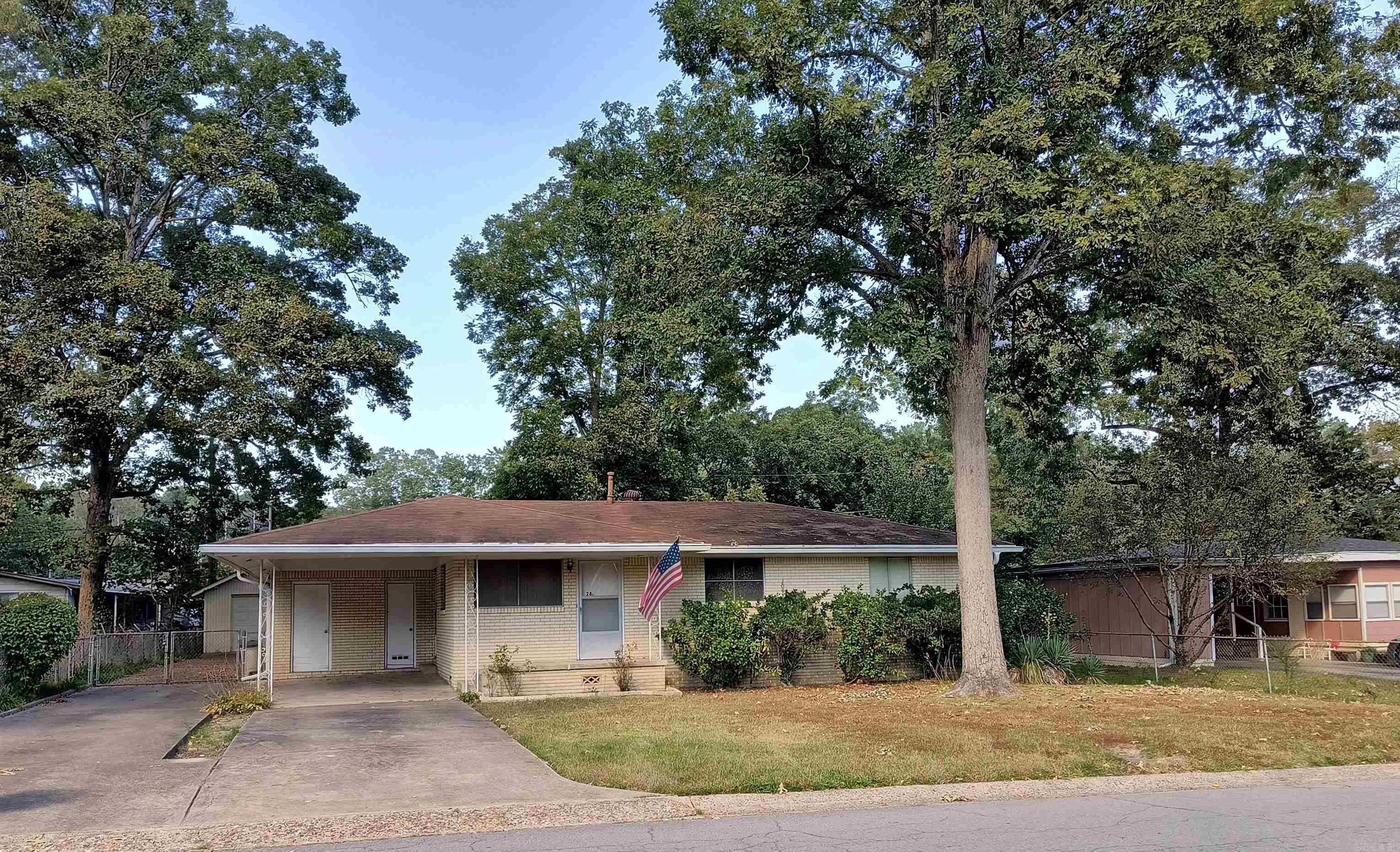 Brick home in a quiet neighborhood. Up to 4 bedrooms. front & back concrete porches, 2011 Morgan metal building and a site-built garage/workshop with equipment 50-amp wiring. Kohler Power Systems Whole House generator installed with leased propane tank. Concrete driveways. Chain-link fenced back yard. New roof in 2011, Hanke Bros. K-Guard gutter system in 2007. Owner participated in the Entergy Arkansas Efficiency program in 2017 and had duct sealing and extra insulation installed. Property is offered in AS-IS condition with no contingencies such as repairs or financing. Contact Agent for showing.