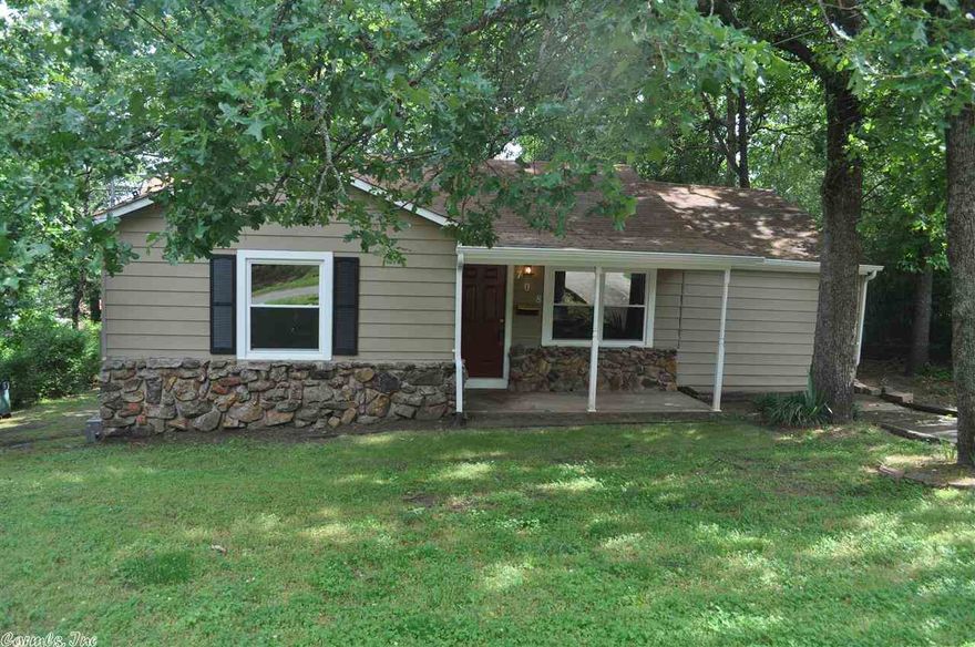 New paint, new carpet, new tile, new kitchen appliances, new cabinets, new countertops, new ceiling fans, new front door, new French doors, plumbing & electrical has been brought up to city code, new duct work, roof a few years old, new double paned windows(fold in)... 2 Living areas! New 12x11 deck,new exterior paint, refinished hardwoods, and new gutters!!!!TALK ABOUT PERFECTION!!! COME GET IT!!!  Sq. Ft. approx. measuring encouraged.