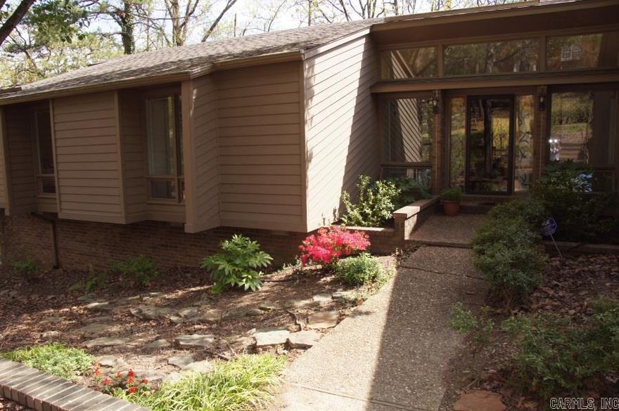 Close to PV Country Club & move in ready. Private lot backs up to wooded greenbelt! Updated home lives like a one level, with 3 beds/2.5 ba on main level surrounded w/ over sized windows framing fabulous views out back. Large living areas, up & down. Guest bed/ba down w/ wet bar & game room. Master on main level w/ custom shower & LG closet. Updated kitchen w/ stainless app., granite & grilling deck. Basketball court, hot tub & workshop in back. Separate laundry room. Comes with pool membership.