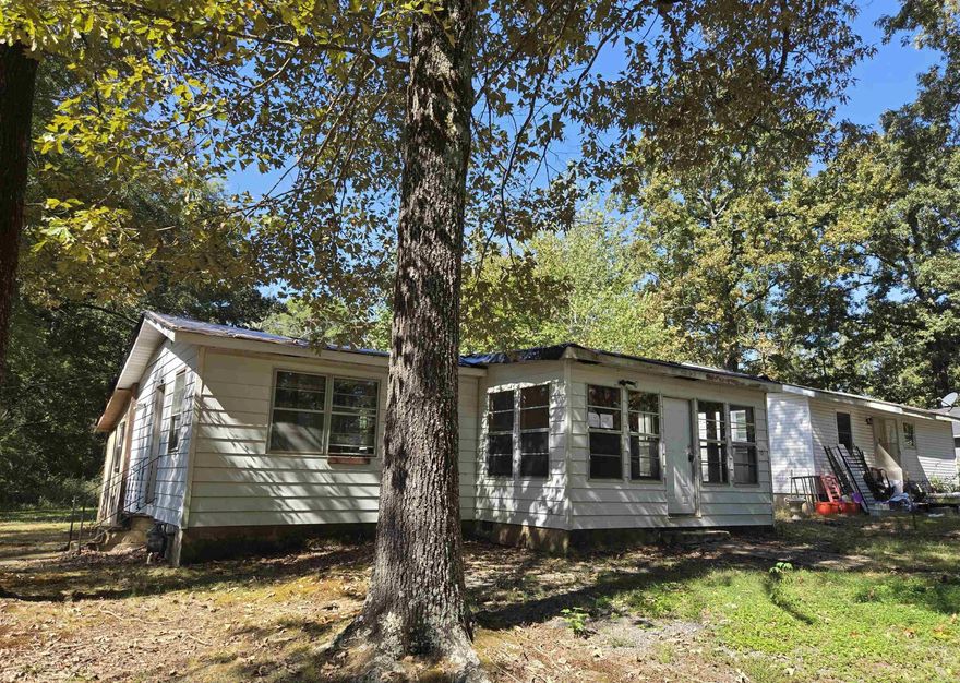 Check out this perfect little fishing cabin! This 1 bedroom has a large living room, dining area and a bonus room. You will be surprised how open and big this cabin feels. Located on a dead-end street, it's the perfect little get-away! Agents read confidential remarks.
