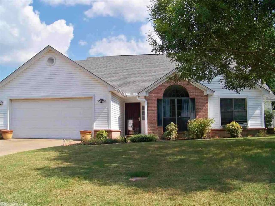 Move in Ready! Great location! This 3BR 2BA house is priced to sell. The home has a breakfast table area w/breakfast bar. Kitchen has tile, pantry, gas cook top, frig stays. Nice size master w/huge closet. Master bath has jetted tub and separate vanities. Wood laminate in entry, formal dining, living and hall. Carpet is new. Vaulted ceiling in LR, dining & kitchen. The house has new paint, roof less than 4yrs, Ht&Air 3yrs. Fenced backyard. 2 car garage. Security system