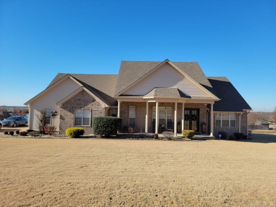 An entertainers dream!! This home has a marvelous floor-plan perfect for your family gatherings or entertaining. Utilize the large living area which is open to both the formal and casual dining spaces and easily overflows onto the large, partially covered patio. The master suite is of ample size and boasts a spa like bath with soaker tub and separate tile shower- close the door and forget about your day! Two additional downstairs bedrooms share a Jack & Jill bath. Upstairs you are treated to two additional very large bedrooms and a full bath. This home looks appealing from every angle and has great views of the lake as well. Wonderfully maintained and well cared for. *Hardwood floors  *Tile back splash *Granite counter tops *Roof *Siding *Garage door *Front entry door all recently updated  ***Stay comfortable with a Generac whole house generator!!*** Take the time to tour this one. Call today!