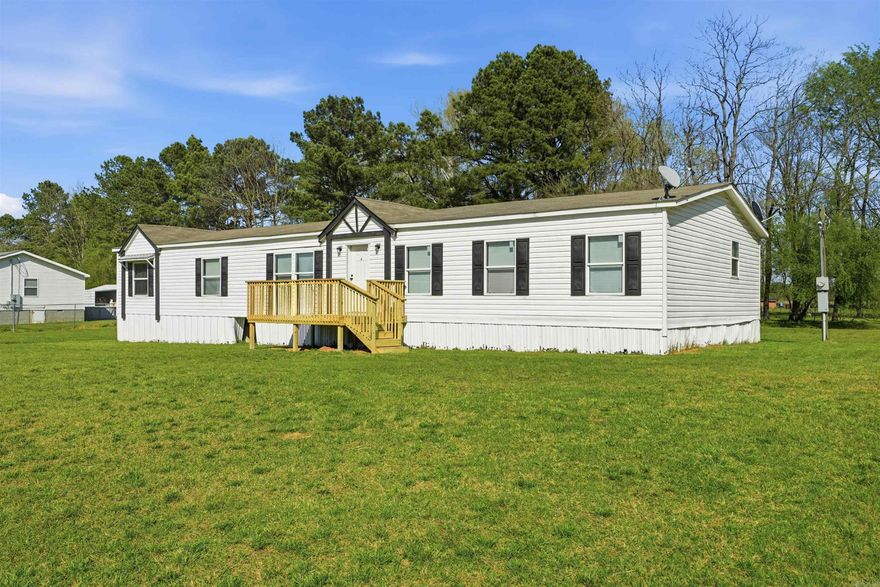 Welcome to this beautifully revamped 2019 manufactured home offering the perfect blend of modern farmhouse charm and peaceful country living. Nestled in a quiet, country setting yet just minutes from the city, this property gives you the best of both worlds. This spacious 4-bedroom, 3-bath home features a desirable farmhouse design with thoughtful updates throughout, including stylish light fixtures and upgraded cabinet hardware that add a fresh, modern touch. The open layout provides plenty of room for both everyday living and entertaining. The oversized primary suite offers a relaxing retreat with a generously sized bedroom and a well-appointed bathroom designed for comfort and convenience. Enjoy the added bonus of river access within the subdivision—perfect for outdoor enthusiasts or anyone who loves a scenic escape close to home. If you’re looking for space, style, and a serene setting without sacrificing proximity to town, this one checks all the boxes!