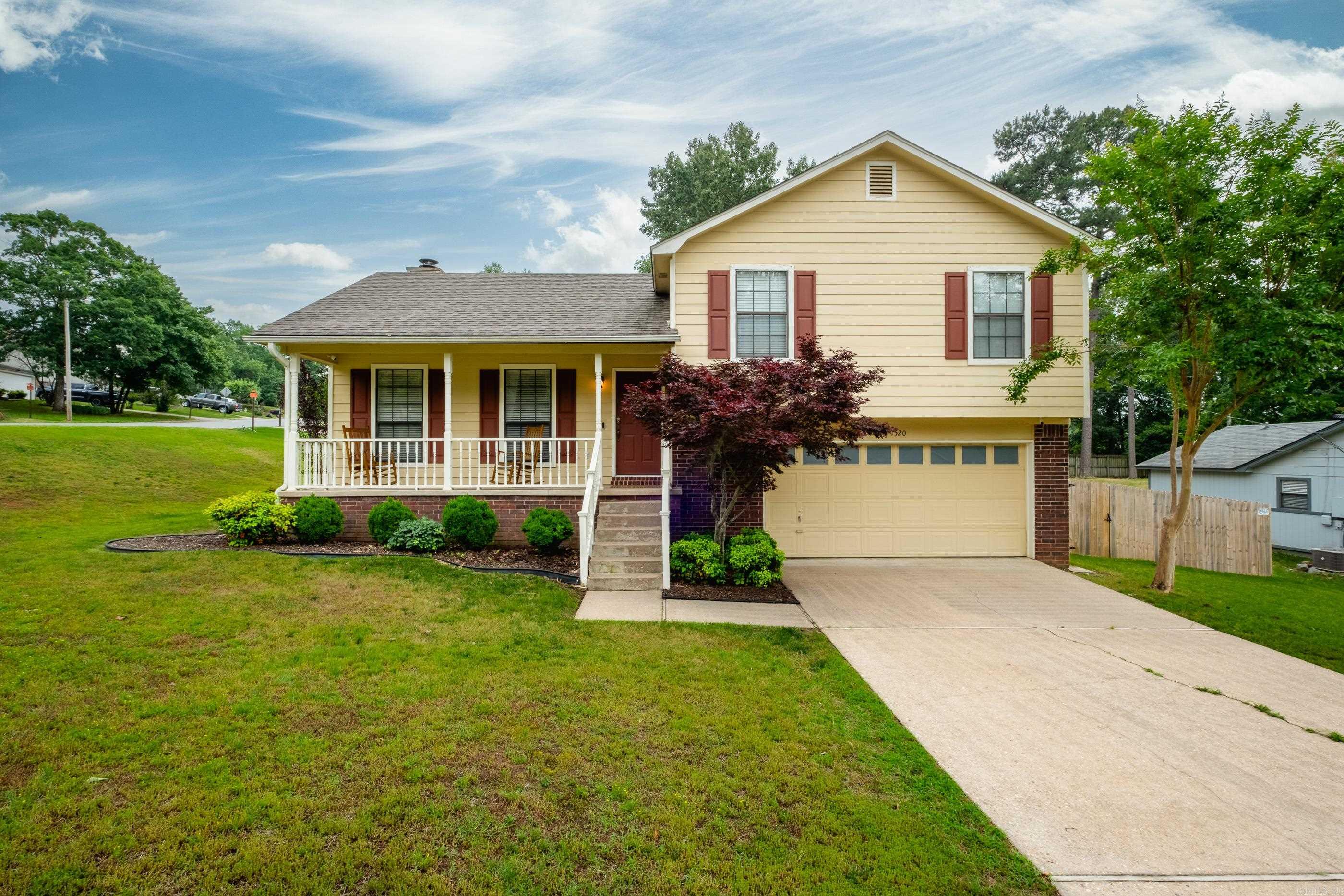 Beautiful home in Point West on a large corner lot with a cozy front porch. Enter into a living space with a corner fireplace & built-ins. Kitchen has granite countertops and SS appliances, including a gas range. The spacious primary suite has a walk-in closet with an ensuite bath. Beautiful waterproof laminate flooring throughout and no carpet. Updates include: roof and neutral interior paint 2020, stainless steel appliances, flooring, garage door opener, and wood fence all in 2023. Large fenced backyard with a huge deck for entertaining. This location is ideally located in the heart of west LR and is close to restaurants, shopping, and easy interstate access to downtown and midtown. Agents, see remarks.