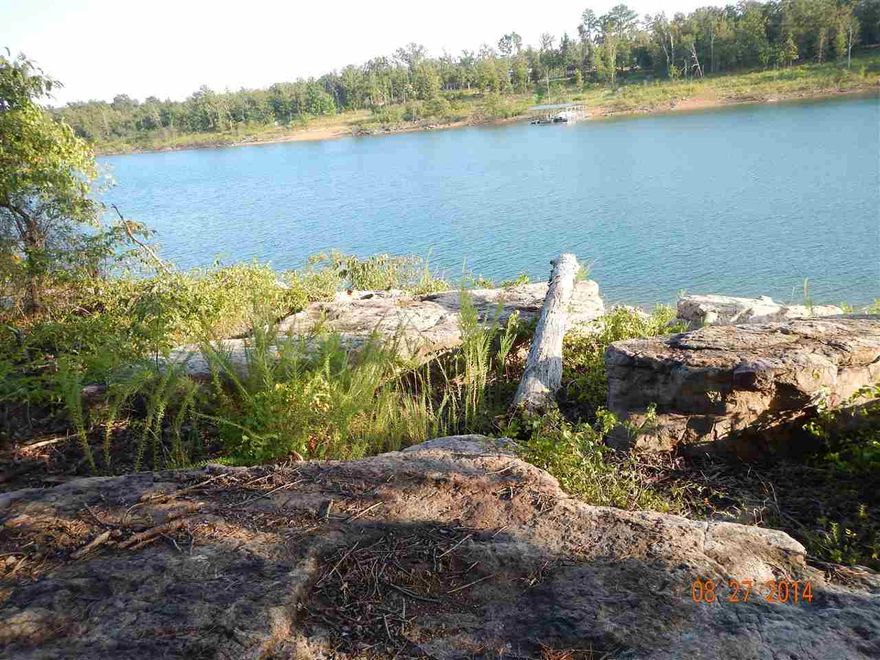 Rare opportunity !! once you get here you will not want to leave! 4 acres Lake front zoned for boat dock, You don't have to be an Olympic athlete to get to the water, Gentle sloping walk to the shore line for swimming with the kids or watching the sunset, white line almost in the lake at the SW corner of property, approx 562' of white line according to Corp boundary survey, another 6 acres also available, also zoned for boat docks, just over 1 mile from Hwy 16