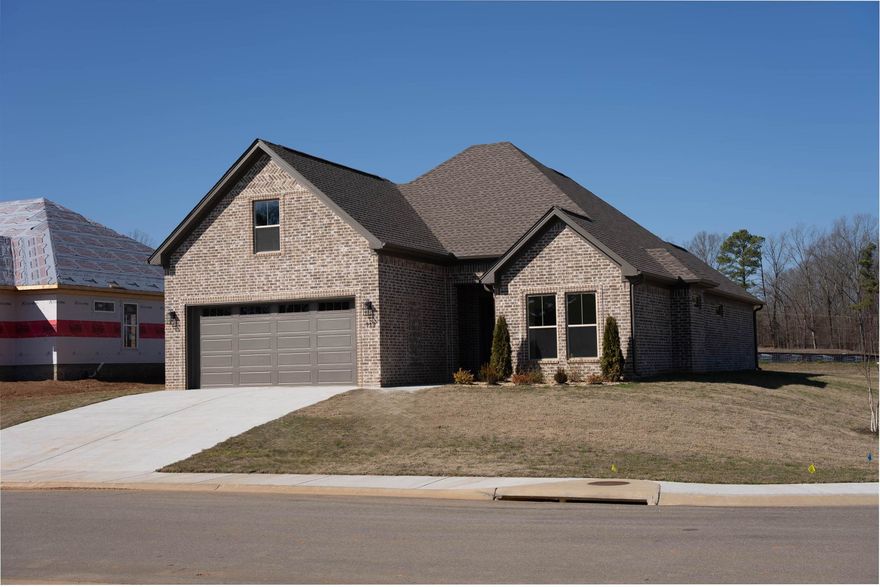 This home sits on corner lot!! Covered back porch, extra large side yard. Great room over looks kitchen with island and walk in pantry. LVP flooring,  Custom cabinets with lots of storage. Primary room has custom ceiling, free standing tub, tile shower. Two bedrooms share bathroom. Upstairs has one bedroom.