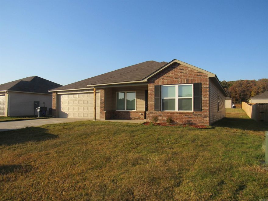 Welcome to modern living in the heart of Conway! This stunning 4-bedroom, 2-bathroom home boasts a fresh and contemporary design, perfect for those seeking a blend of style and comfort. As you step inside, you'll be greeted by a spacious open area that seamlessly connects the living room to the eat-in kitchen, creating an inviting atmosphere for entertaining and everyday life. The heart of the home is the kitchen, equipped with sleek stainless steel appliances, ample cabinetry, and a generous eat-in area for family meals. The luxury vinyl plank flooring throughout the home not only adds an element of elegance but also ensures durability and ease of maintenance. Each bedroom features the sophisticated touch of Cheyenne style doors, adding a unique aesthetic to the private spaces. The living room is illuminated by energy-efficient LED disk lights, providing a bright and welcoming environment. The master suite is a true retreat, complete with a private bathroom and plenty of closet space. The additional bedrooms offer flexibility for a growing family, a home office, or guest rooms.