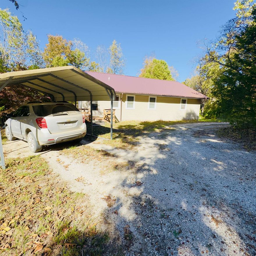Surrounded by the rolling hills of the Ozarks, this well-maintained 2-bedroom, 2-bathroom home sits on 41.60 secluded acres at 672 Blevins Road in Violet Hill, Arkansas. The property is tucked away on a gravel road, offering exceptional privacy while remaining just a short drive from local conveniences. This 1440 square foot home features updated vinyl siding, a new metal roof, and beautiful hardwood flooring throughout. Appliances are included with the sale, making this home truly move-in ready. Enjoy scenic views from the large back deck—perfect for relaxing, entertaining, or watching the wildlife. With a pond and mixed wooded terrain, this land is ideal for hunting, recreation, or starting a small hobby farm. In addition, this property offers a detached covered carport, a 24x30 shop/garage, and a 20x40 shop building.  If you’re looking for a homestead, weekend getaway, or a place to connect with nature, this Ozark retreat is ready for its next owner! Listed for $239,000. Schedule your showing today and experience country living at its best!