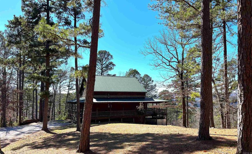 Custom cabin perched high on a mountain in a beautiful, gated cabin community. The cabin was strategically built to take advantage of the gorgeous views looking over the White River Valley. Built in 2008, there's 5 sleeping areas and 2 full baths. The living area has a vaulted ceiling, floor to ceiling propane fireplace and floor to ceiling windows. The kitchen is very spacious with an island and a bar. Master bedroom is on the main level featuring large windows with big views and access to the covered deck. Upstairs is a large sitting/tv area, 2 guest bedrooms and guest bath. The finished basement has 2 sleeping areas, game room and a tv area. The wraparound porches provide plenty of outdoor entertaining or relaxing areas. The 13+/- acres is very diverse with woods, trails, seasonal waterfall and spectacular views. An outdoor shower lets you clean up after a busy day exploring. White River public boat ramp is approximately 1.6 miles away. You are only minutes from the National Forest, Blanchard Springs Caverns and all Mountain View have to offer. Property is currently on a successful nightly rental program. Restrictions are in place to protect your investment.