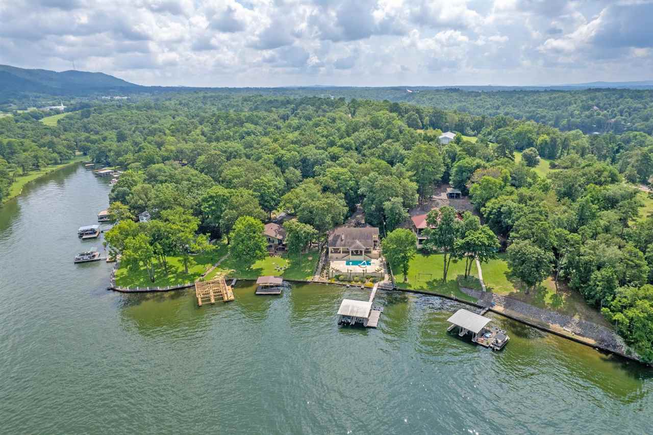 Prepare yourself for a jaw dropping view down the main channel of Lake Hamilton with inspirational sunsets and moonrises. From the moment you arrive, the open and airy home welcomes you and the easy flow of the living spaces, veranda and pool deck simply relieves any stress of the day while creating the perfect environment for entertaining. Saltwater pool with recent upgrades. 2 stall covered dock with 2 boat lifts and 2 PWC floats. Metal Roofing. Tankless water heater.