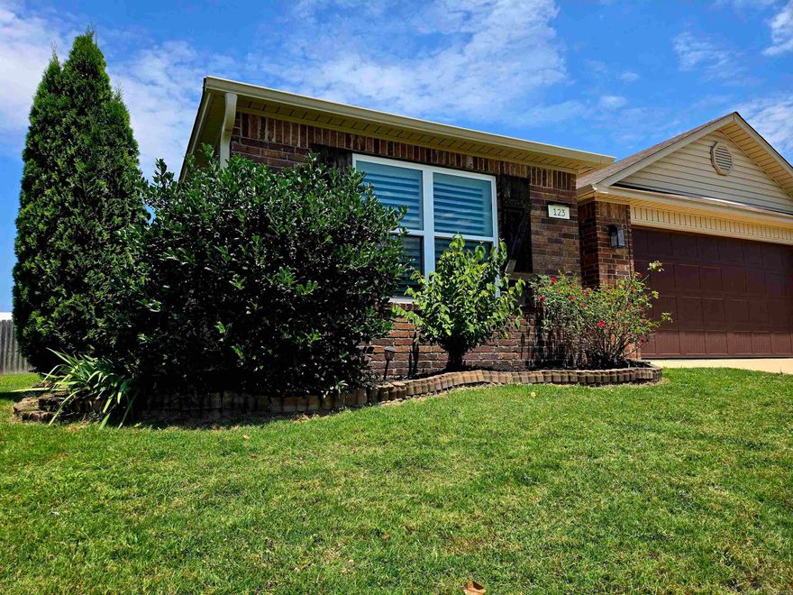 Welcome to 123 Harper Drive – where space, comfort, and charm meet in the heart of the Brookland School District! This beautifully maintained 3-bedroom, 2-bath home sits on a large, fully fenced lot with incredible outdoor features that make it truly stand out.  Step inside to discover vaulted ceilings and elegant tray ceilings in each bedroom, adding a sense of openness and detail throughout the home. Enjoy durable LVP flooring in the main living areas and cozy carpet in the bedrooms for added comfort.  The heart of the home flows into the outdoors with a custom pergola covering an oversized back patio—perfect for relaxing or entertaining. The backyard is a dream for garden lovers and hobbyists alike, featuring two producing peach trees, a grapevine, a dedicated garden space, and a 10x15 storage shed/shop for all your tools and toys.  The home also includes a two-car garage, thoughtful landscaping, and is nestled in a quiet neighborhood just minutes from schools and town amenities.  Don’t miss your chance to own this rare gem in Brookland—homes with this much outdoor value and character don’t come around often!