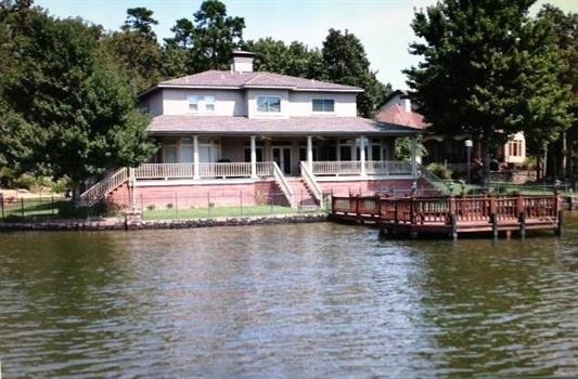 PRICE JUST REDUCED !!! EXQUISITE LAKEFRONT HOME. The 1.22 beautifully landscaped acres provide privacy & peaceful enjoyment. Enjoy the breathtaking lake views from all levels of the house, from the deck and/or from the spacious, lighted dock. All new hardwood flooring throughout the lower level, compliments the new kitchen cabinets & granite cabinet tops. Large main level master suite. 3 upstairs bedrooms each with a private bath. Open floor plan to decorate to "fit your family."
