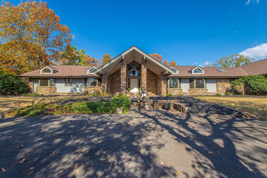 This beautiful Conway estate home is nestled down a long, private drive among 5 wooded, private acres with expansive landscaping. Updates include a new roof, new skylights, new interior paint, new fixtures, new rock columns, new deck, and more! This 2 level home is perfect for entertaining with a large kitchen with wet bar, dining room, and gorgeous slate floored living with large windows for natural light and upper deck access. Upstairs you will find new paint throughout, new fixtures, a large primary suite, 2 full bathrooms, 2 guest bedrooms, and a half bath & large laundry room. Downstairs you will find a large living space with another wet bar, a bedroom, a full bathroom, and multiple flex rooms; perfect for more bedrooms or office space. You will find many storage options throughout-both interior & exterior.