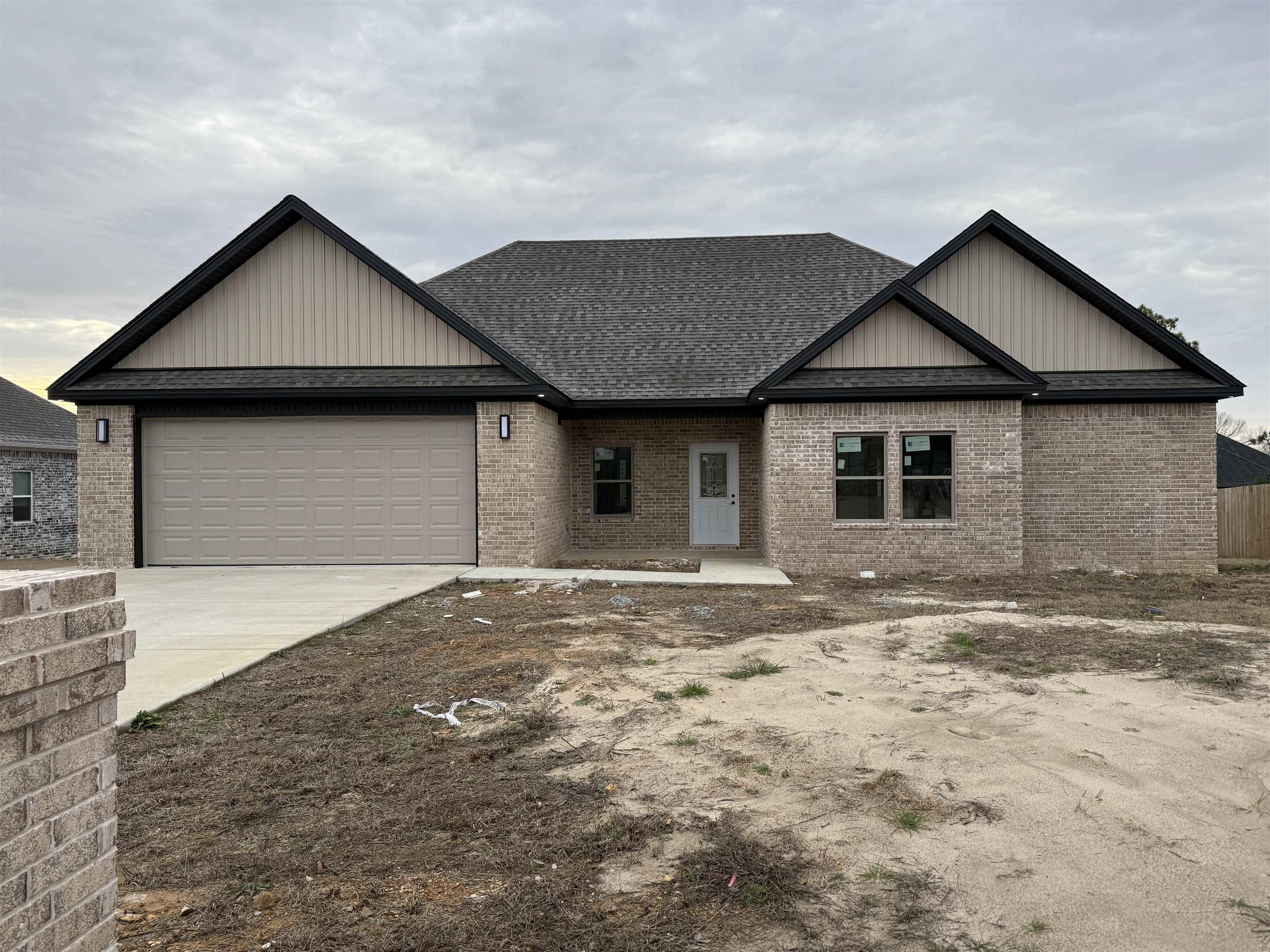 Welcome to this stunning new build located in the desirable Hidden Valley neighborhood in Beebe, Arkansas. This spacious 3-bedroom, 2-bathroom home offers 1,887 square feet of modern living space designed with both comfort and style in mind. The home features a beautiful brick exterior and a spacious two-car garage. Inside, the open-concept kitchen and living area is perfect for entertaining. The kitchen boasts white cabinetry, a large island with a breakfast bar, modern stainless steel appliances, and stylish pendant lighting. The living area is spacious with large windows that let in plenty of natural light and features luxury vinyl flooring. The luxurious master bathroom includes a freestanding tub, dual vanities, and a large walk-in shower, complemented by a substantial walk-in closet. Two additional well-sized bedrooms offer ample closet space, while the second bathroom features contemporary fixtures. A covered back patio overlooks a spacious backyard, ideal for outdoor relaxation and entertainment. With durable luxury vinyl flooring and recessed lighting throughout, this home in Hidden Valley perfectly blends luxury and comfort in a prime location.