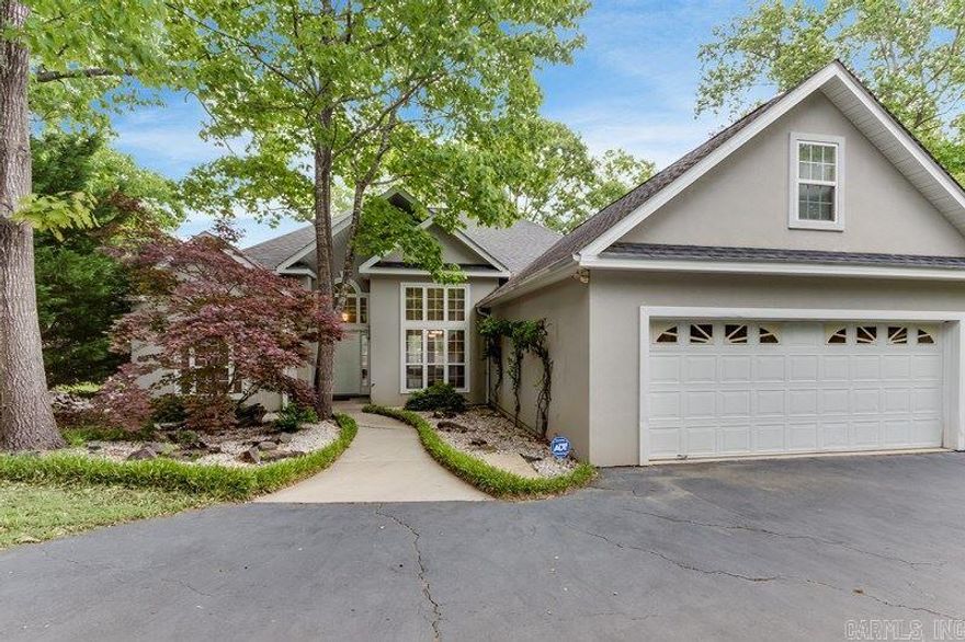 The perfect retreat on Lake Hamilton. Solid home built with 2x6 exterior walls and inside there are hardwood floors, open kitchen with granite, double ovens and a gas cooktop. There is a motorized stairway to the floored attic and a concrete finished basement. Plenty of parking and a flat backyard to enjoy sitting lakeside.