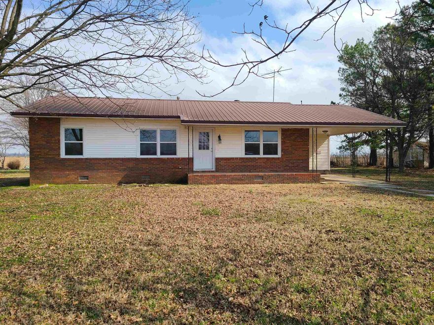 This newly remodeled home has 3 bedrooms, 1 bath, 1,216 sq ft of living space and sits on a large half acre lot outside of Greenway. This property has been completely remodeled from top to bottom on the inside with updates such as new windows, new vinyl plank flooring throughout, custom made cabinets, solid surface counter-tops in kitchen and bathroom, tiled backsplash, new bathtub with tiled shower, new interior, exterior, and closet doors, newly textured ceilings, new light fixtures, fresh paint throughout whole house, new water heater, and all brand-new stainless kitchen appliances! The home also includes a separate laundry room, attached carport and a 26'x32' shop building. Call your favorite realtor to schedule a showing!