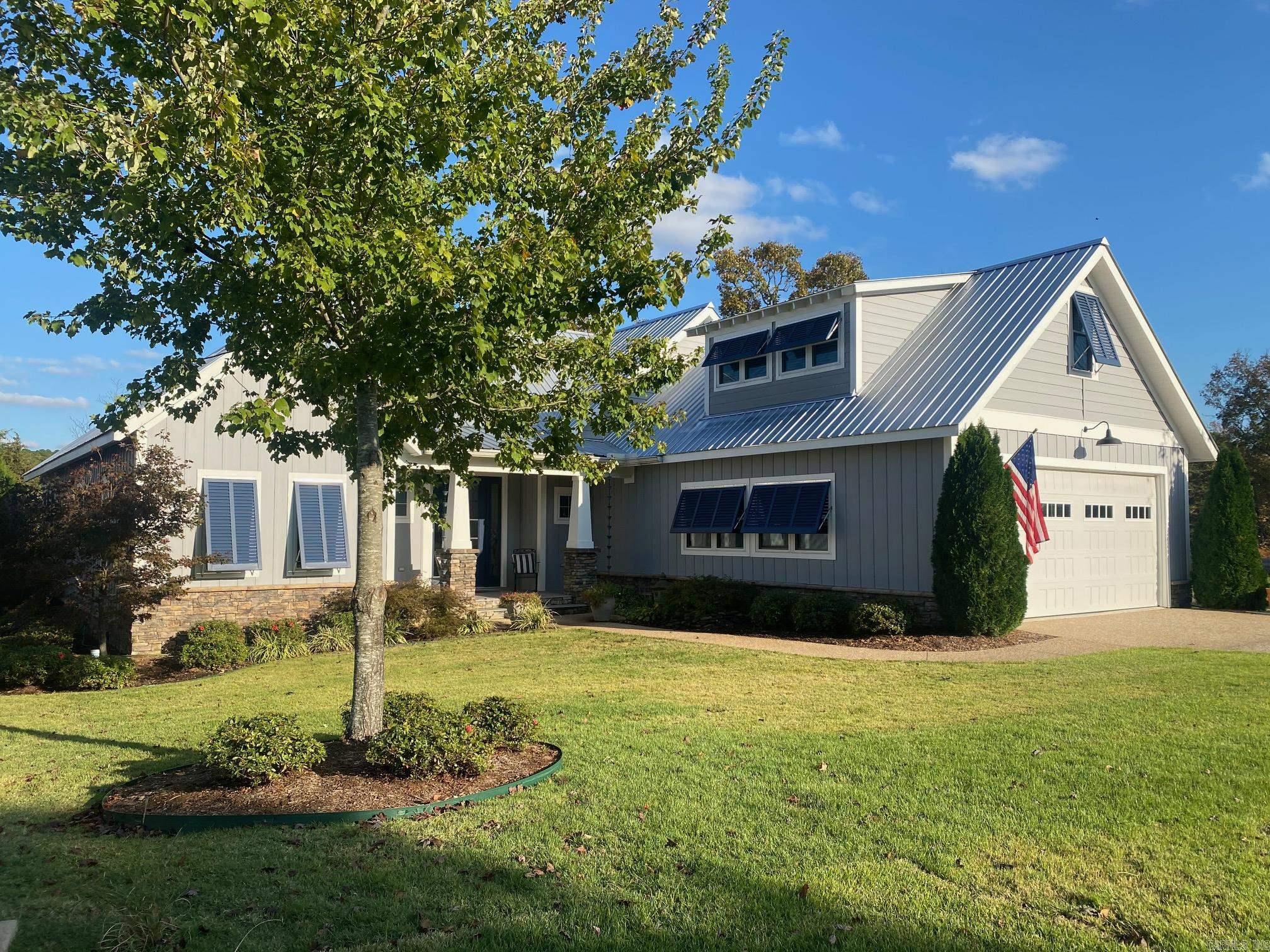 Beautiful upscale gated subdivision in Heber Springs on Greers Ferry Lake. This custom lake front home was built in 2020. This is a beautiful open concept home with a gorgeous fireplace in living area, an upstairs bonus room with a full bath, a cooking shack on back deck along with a hot tub, sunroom off the master bedroom and an EV plug in garage for your electric vehicle to name just a few. This gated subdivision is the perfect place to relax, take a walk, or take a swim in the pool, or head over to Dam Site Park which is less than 5 minutes away!! Some furniture in home will be available to purchase. Seller also owns lot across street, mls#24029307 that is available for purchase.